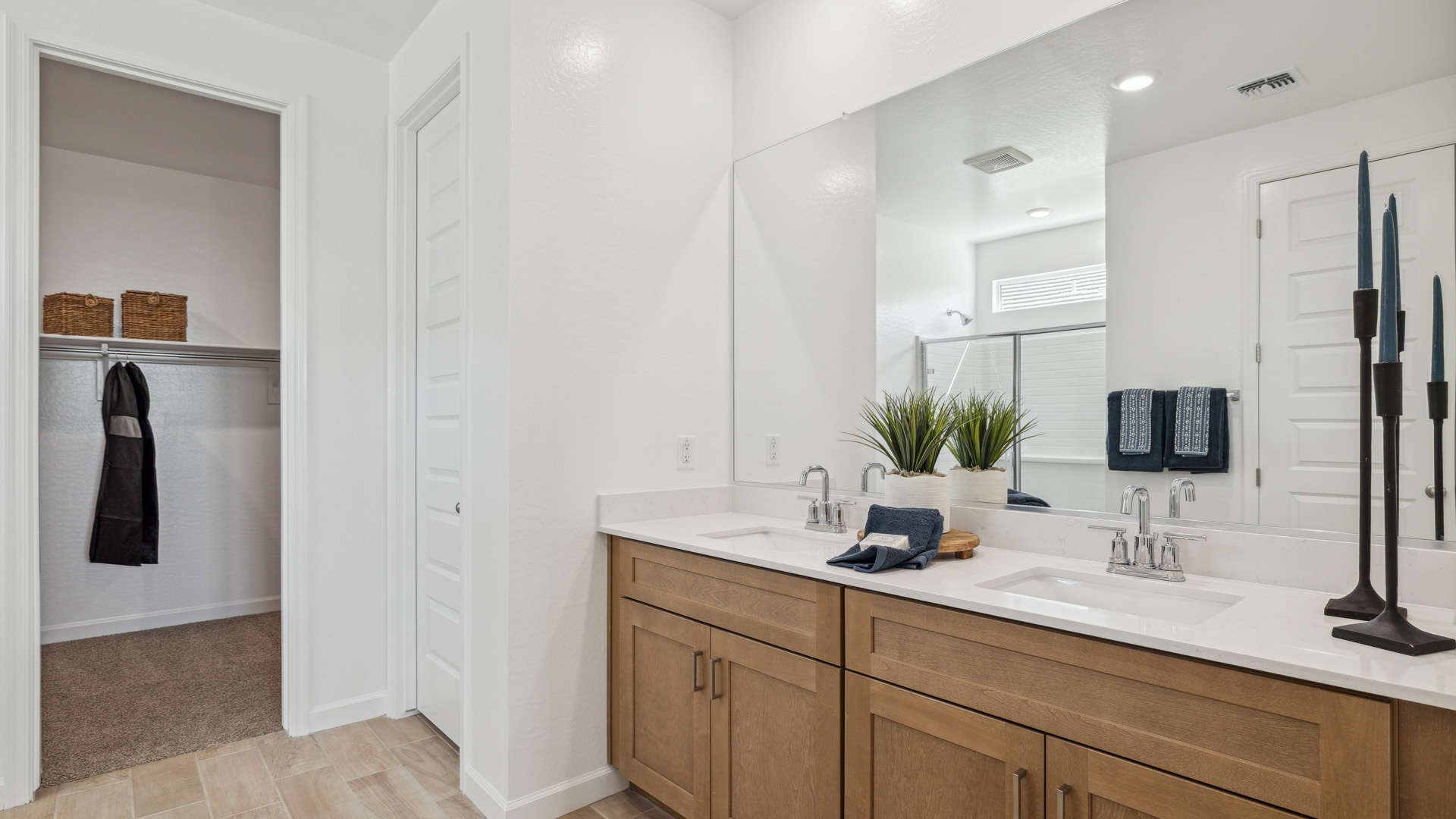 primary bathroom with dual vanities