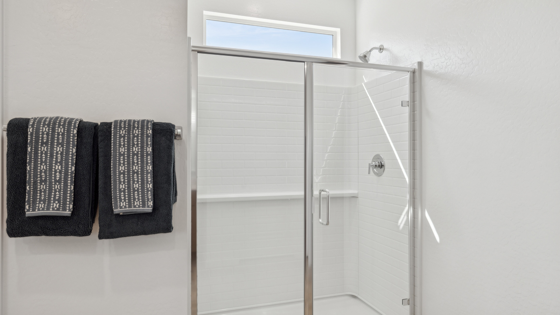 primary bathroom with dual vanities
