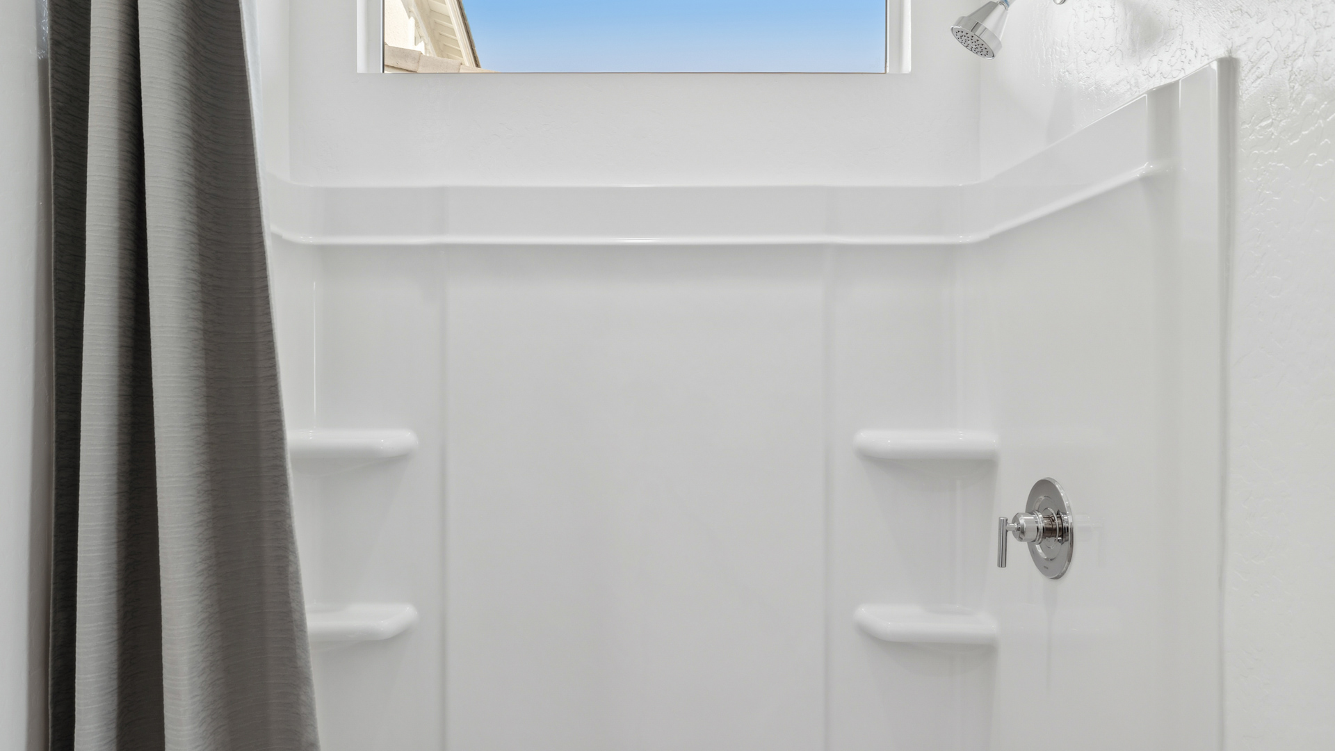 primary bathroom with dual vanities