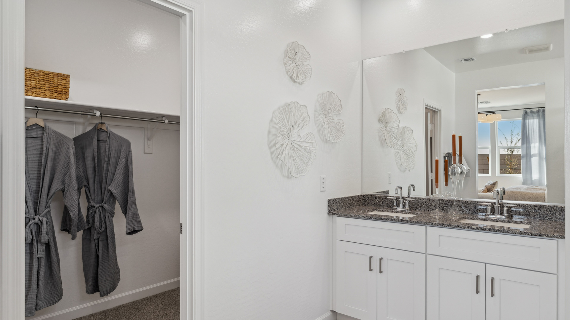 primary bathroom with dual vanities