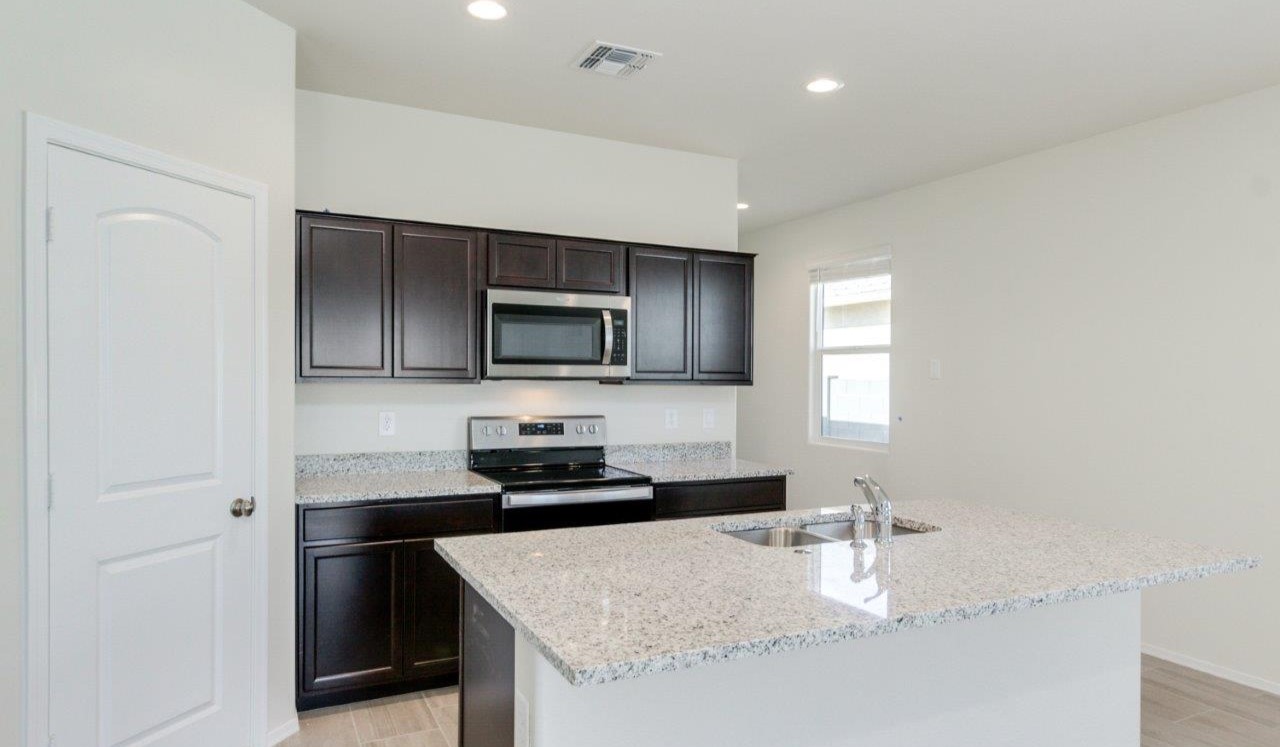 matterhorn kitchen with brown cabinets and tile flooring