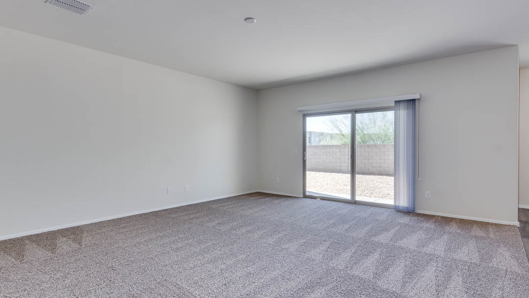 Fuji great room with sliding glass door going to the backyard