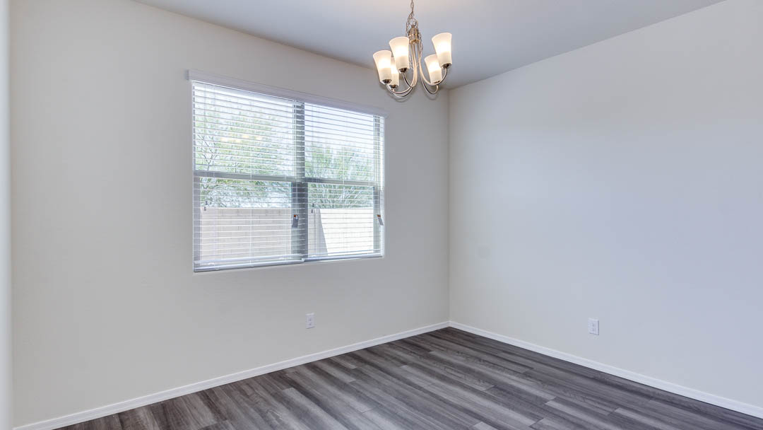 Fuji bedroom with windows and carpet flooring