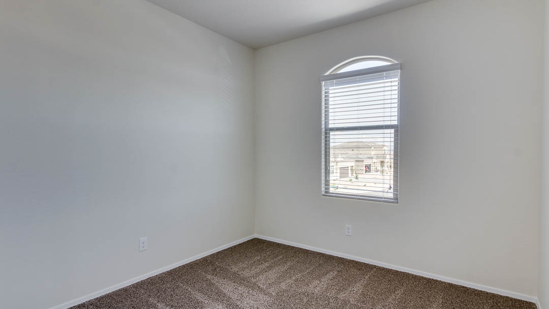 Fuji bedroom with windows and carpet flooring