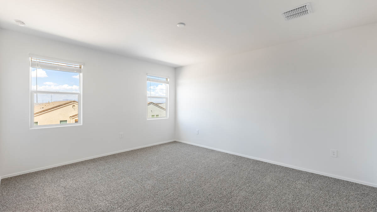 Yosemite bedroom with windows and carpet flooring