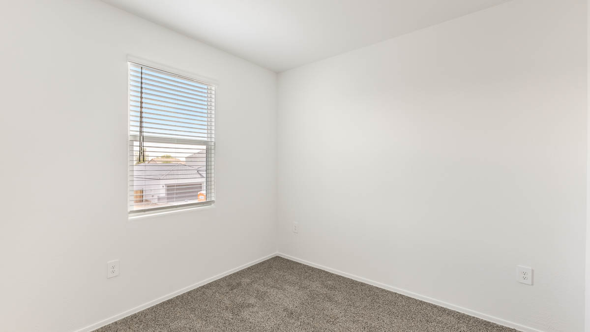 Yosemite bedroom with windows and carpet flooring