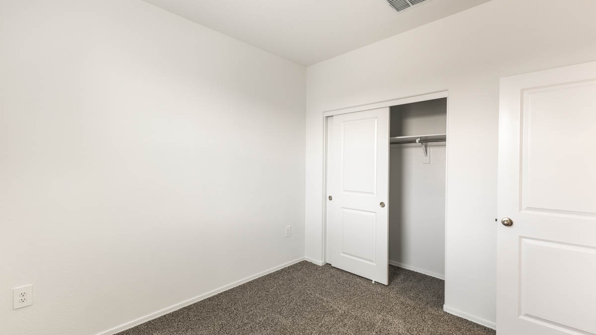 Yosemite bedroom with windows and carpet flooring