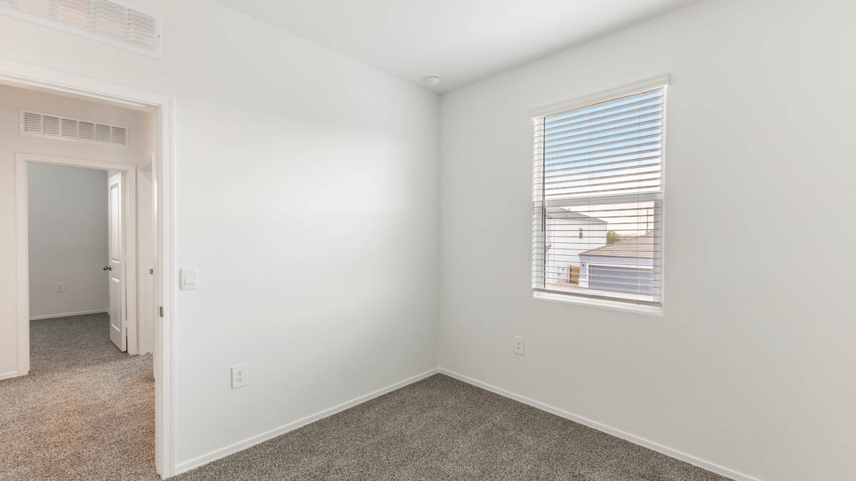 Yosemite bedroom with windows and carpet flooring