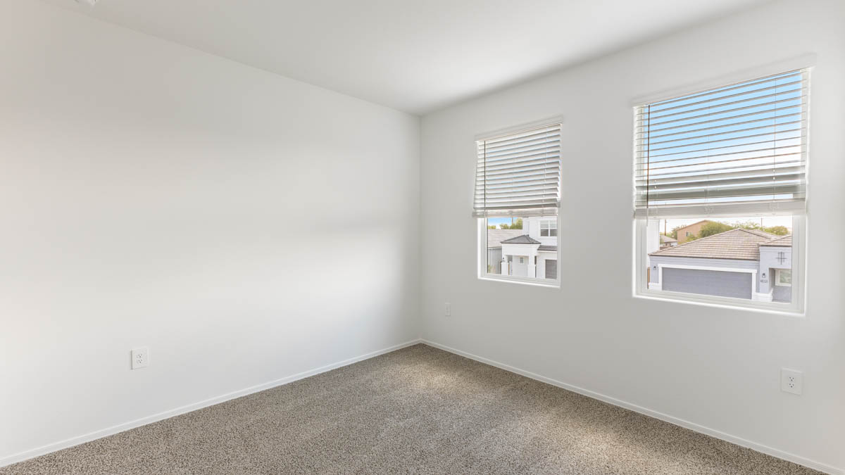Yosemite bedroom with windows and carpet flooring