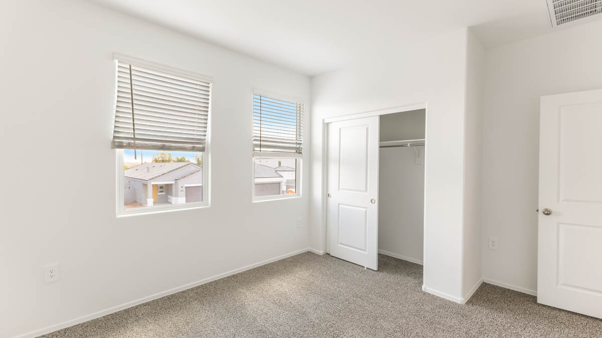 Yosemite bedroom with windows and carpet flooring