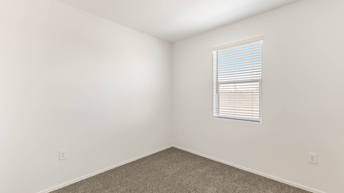 Yosemite bedroom with windows and carpet flooring