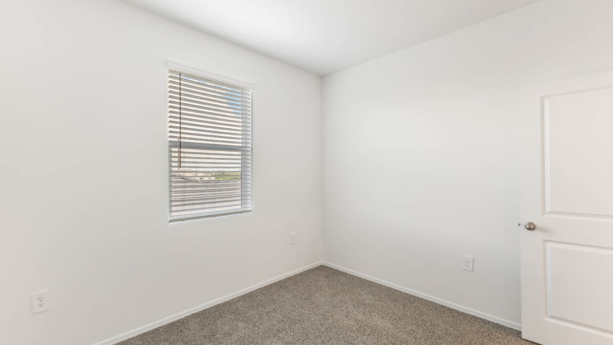 Yosemite bedroom with windows and carpet flooring