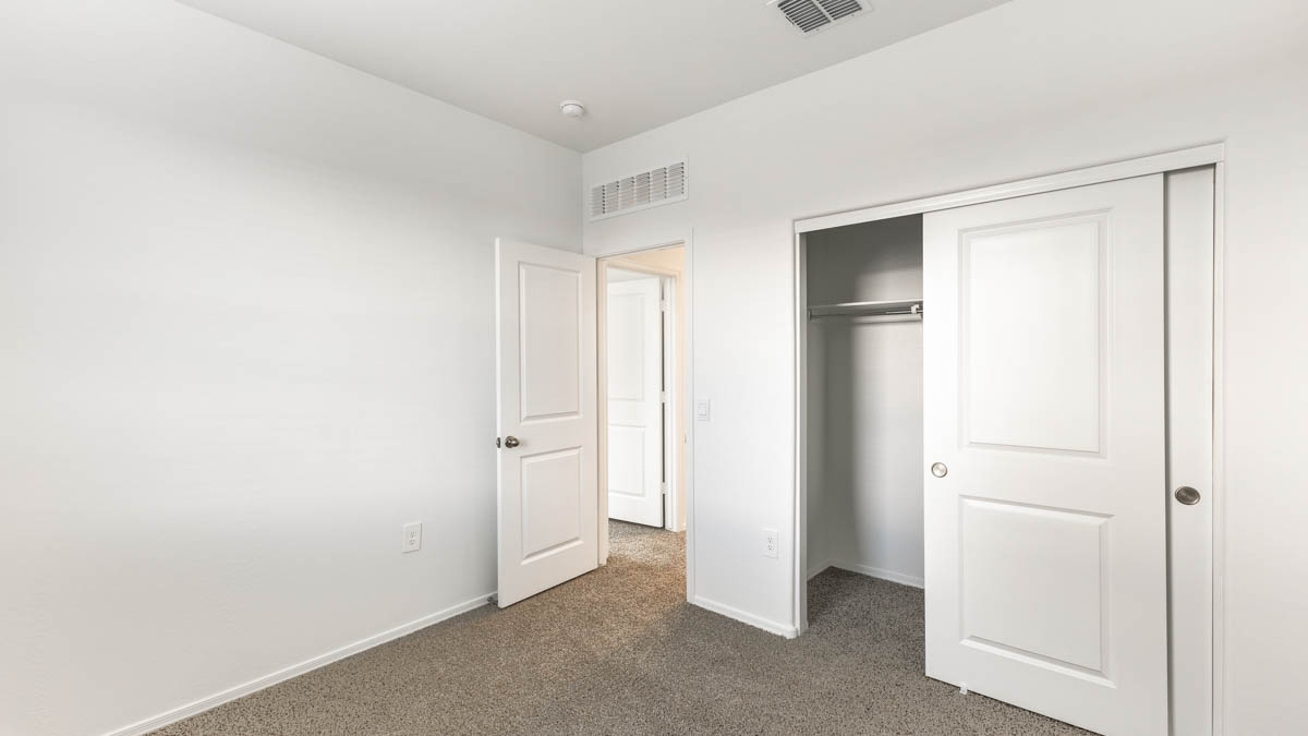 Yosemite bedroom with storage closet and carpet flooring