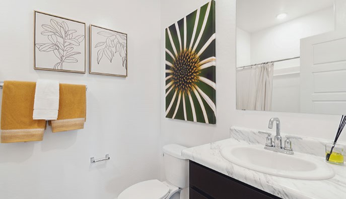Gaven bathroom with brown cabinets