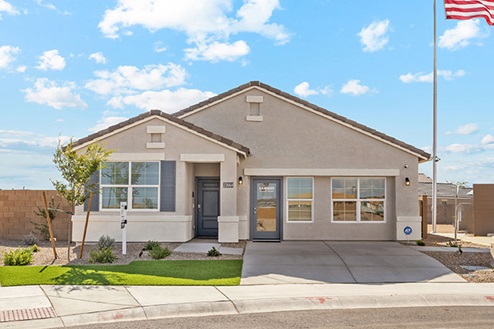 One story home with brown stucco and a gray front door,