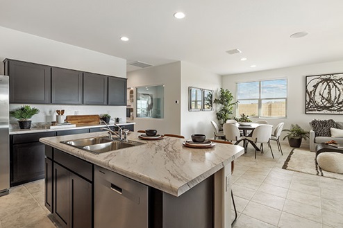 Kitchen featuring brown cabinets, stainless steel appliances, and a large island.