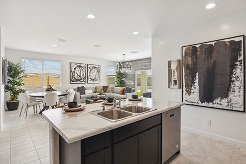 Kitchen featuring brown cabinets, stainless steel appliances, and a large island.