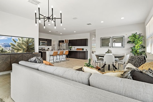 Living room area with couch, coffee table, and entertainment center.