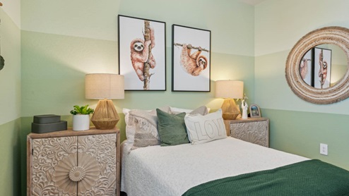 Comfortable guest bedroom featuring neutral-toned walls, carpeted flooring, and a large closet.
