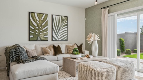 A well-organized living room that includes a kitchen and dining area, creating a warm and welcoming environment for gatherings.