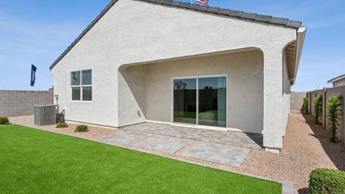 Large fenced-in backyard with a covered patio, perfect for outdoor entertaining.