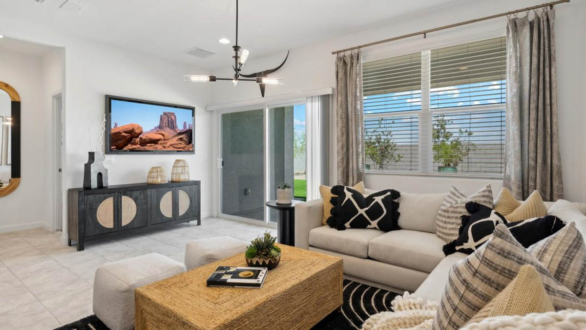 A well-organized living room that includes a kitchen and dining area, creating a warm and welcoming environment for gatherings.