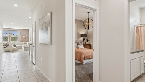 Entry hallway leading to living room and kitchen in the background.