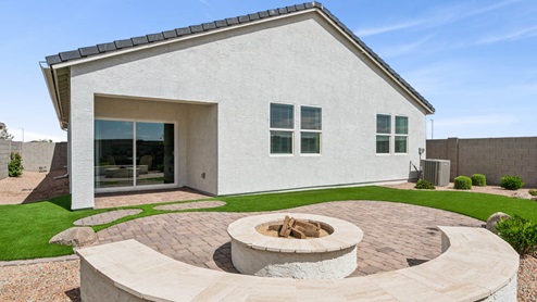 Large fenced-in backyard with a covered patio, perfect for outdoor entertaining.