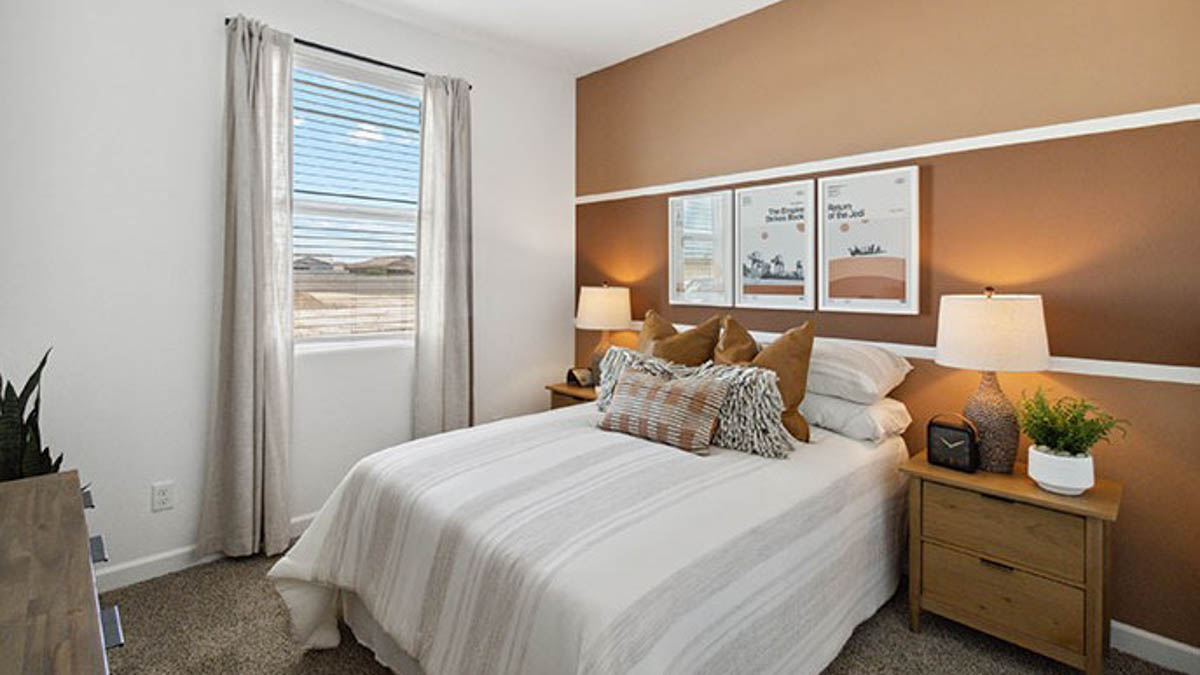 Primary bedroom designed for privacy and space with a convenient flow into spa-inspired ensuite bathroom and walk-in closet