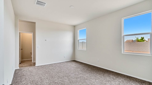 Camden bedroom with windows and carpet flooring