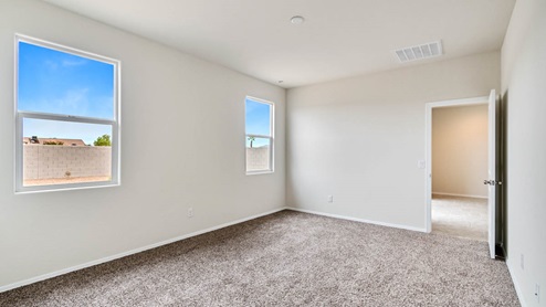 Camden bedroom with windows and carpet flooring