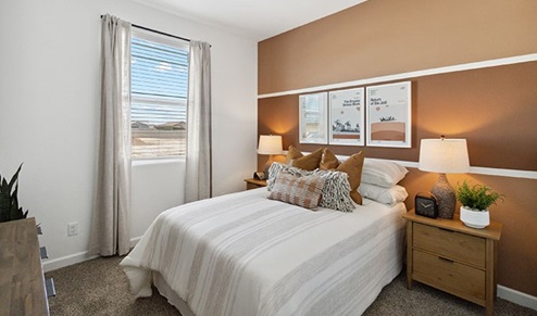 Harris bedroom with windows and carpet flooring