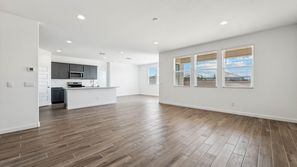 Open concept first floor with the living room, dining room and kitchen next to each other