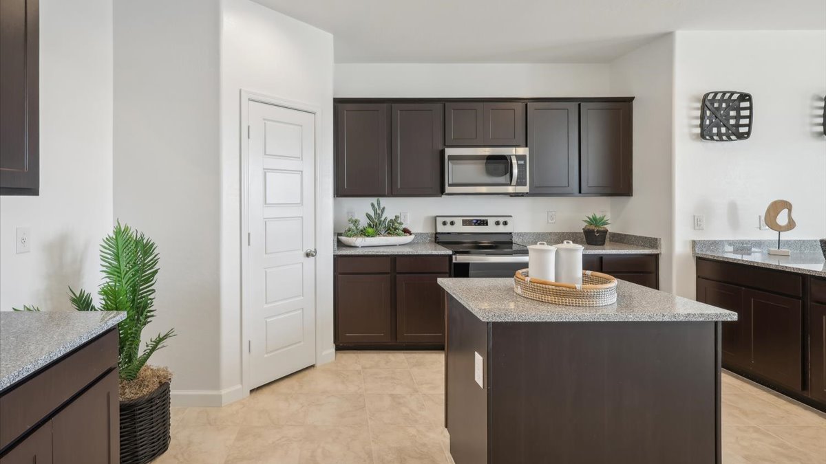 Taylor kitchen with brown cabinets and corner pantry