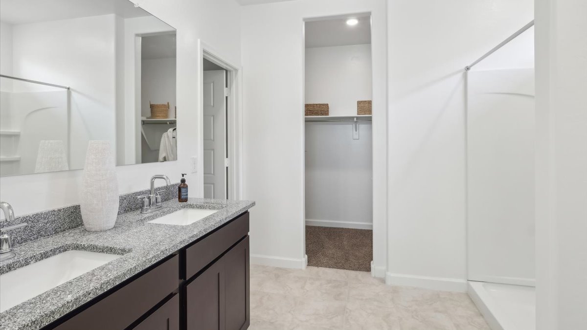 Taylor bathroom with brown cabinets and extra storage