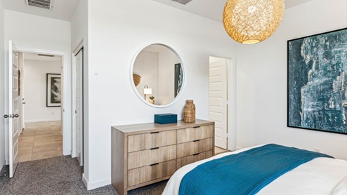 A cozy guest bedroom with private bath connected