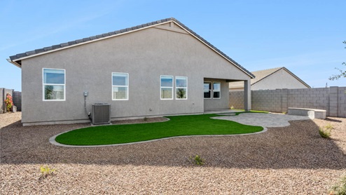 Large fenced-in backyard with a covered patio, perfect for outdoor entertaining