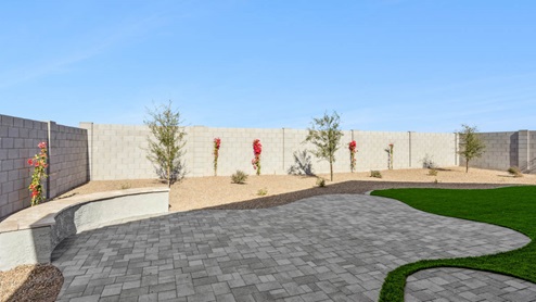 Large fenced-in backyard with a covered patio, perfect for outdoor entertaining