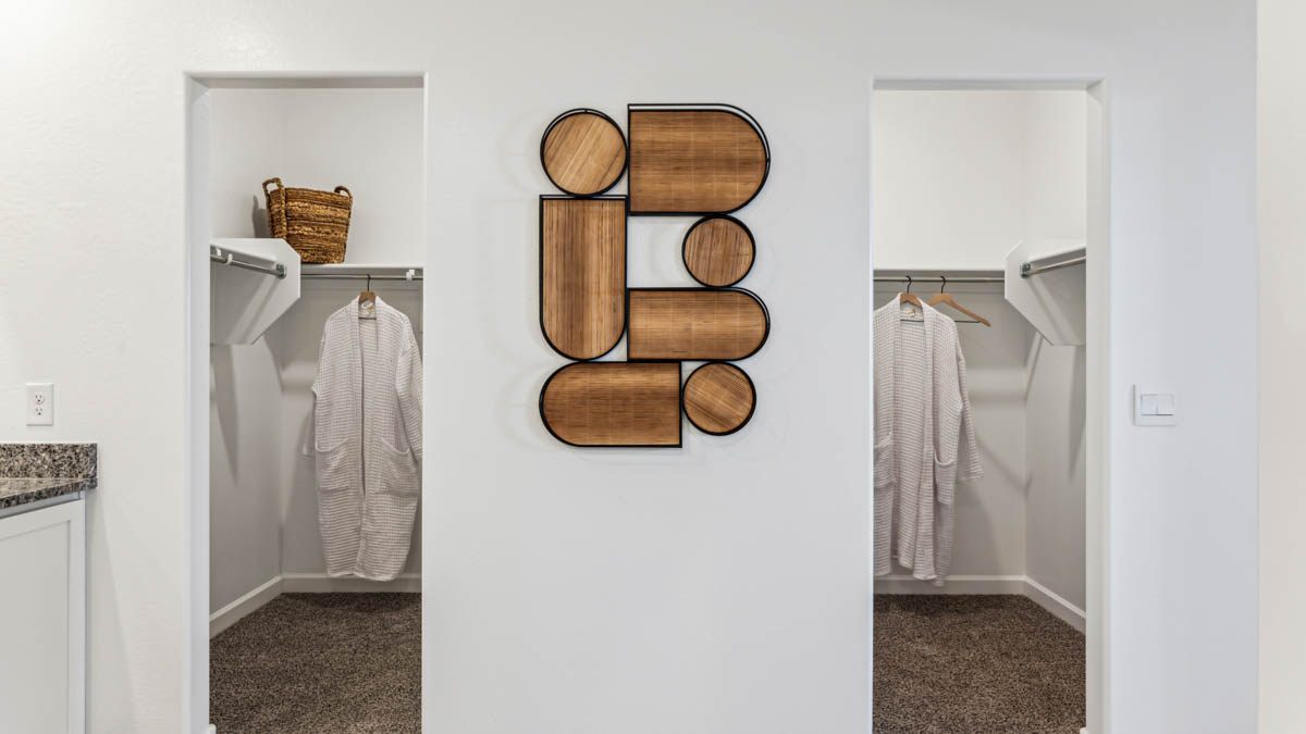 Primary His and Hers Walk-In Closet