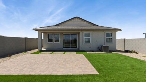 Large fenced-in backyard with a covered patio, perfect for outdoor entertaining.