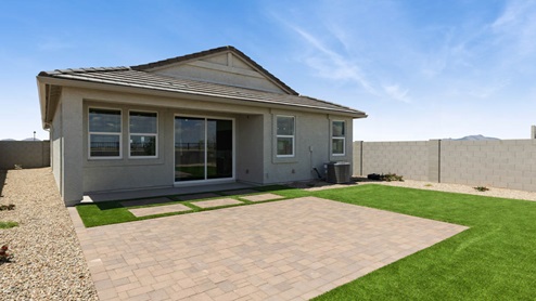 Large fenced-in backyard with a covered patio, perfect for outdoor entertaining.