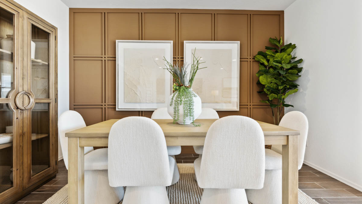 A well-organized living room that includes a kitchen and dining area, creating a warm and welcoming environment for gatherings.