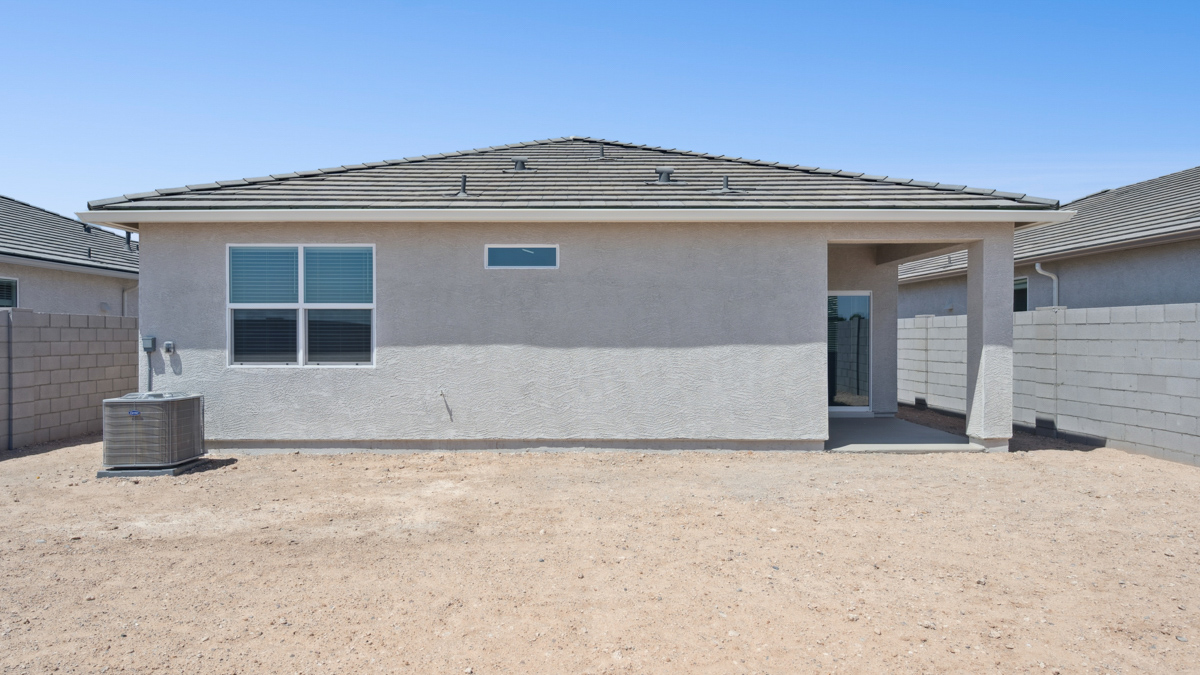 Large fenced-in backyard with a covered patio, perfect for outdoor entertaining.