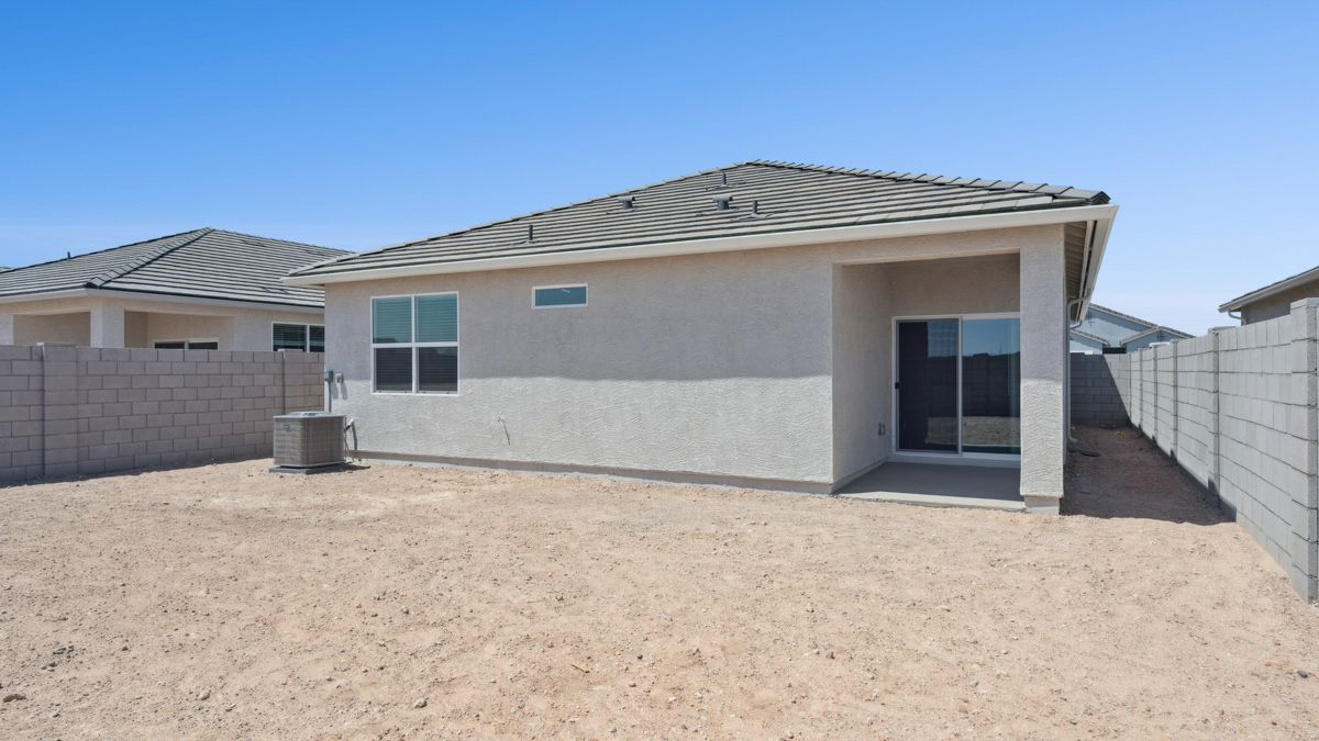 Large fenced-in backyard with a covered patio, perfect for outdoor entertaining.