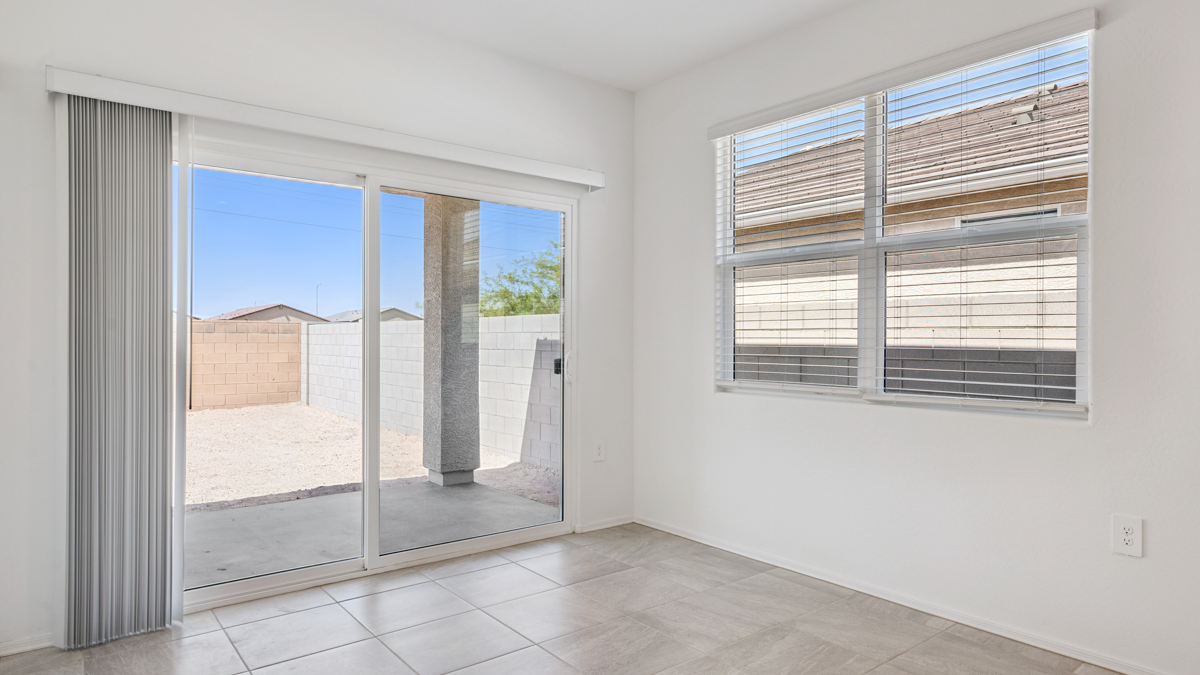 A well-organized living room that includes a kitchen and dining area, creating a warm and welcoming environment for gatherings.