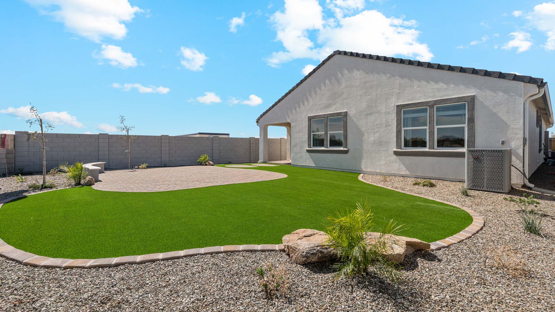 back of home with covered patio