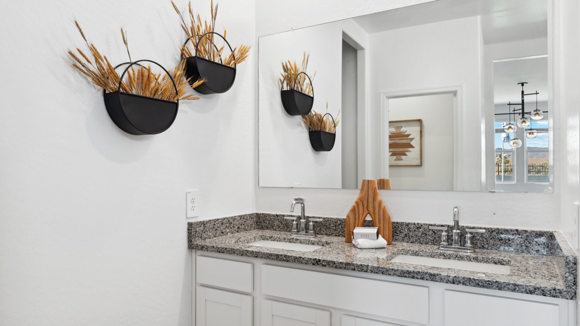 primary bathroom with dual vanities