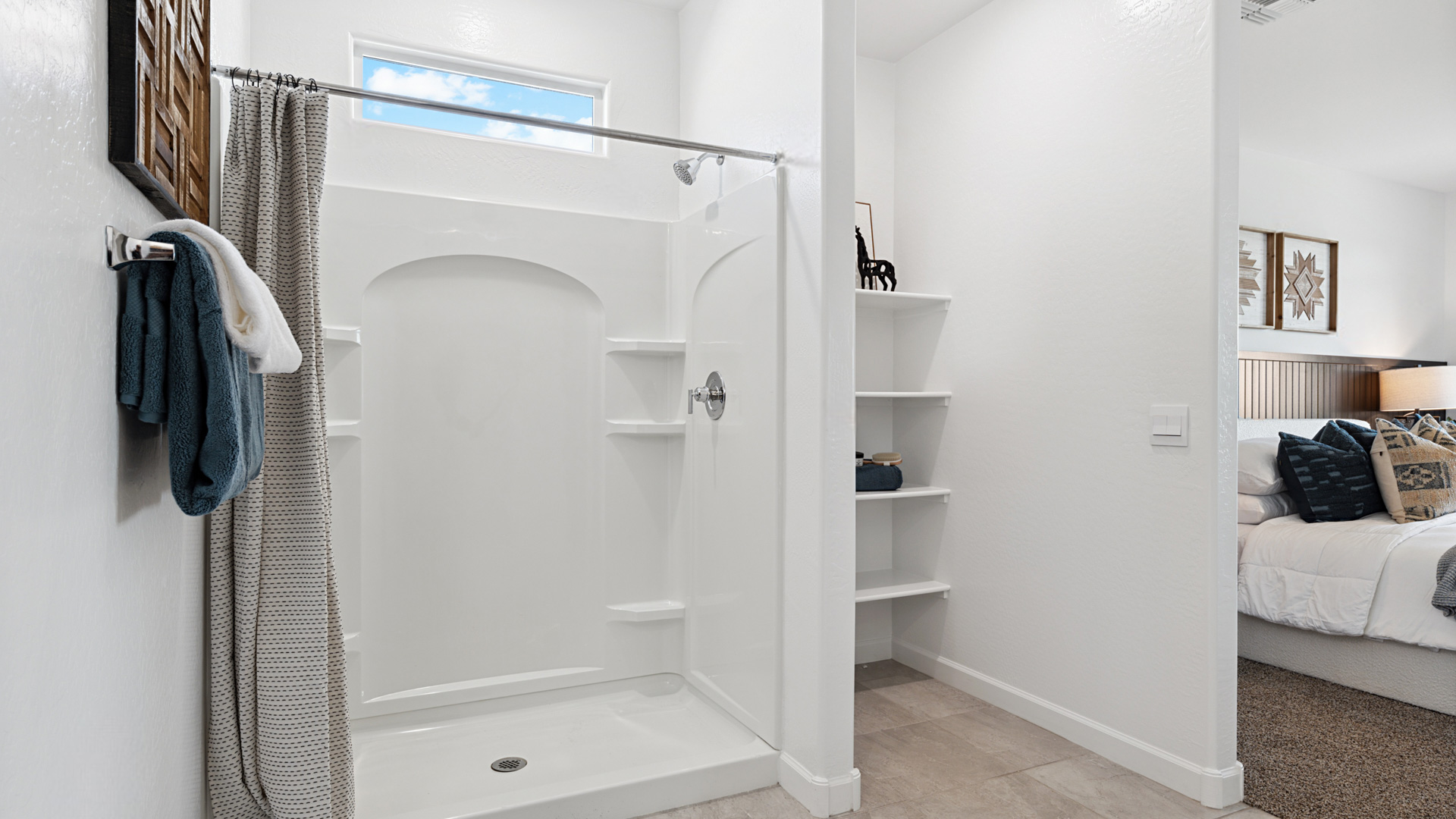 primary bathroom with dual vanities