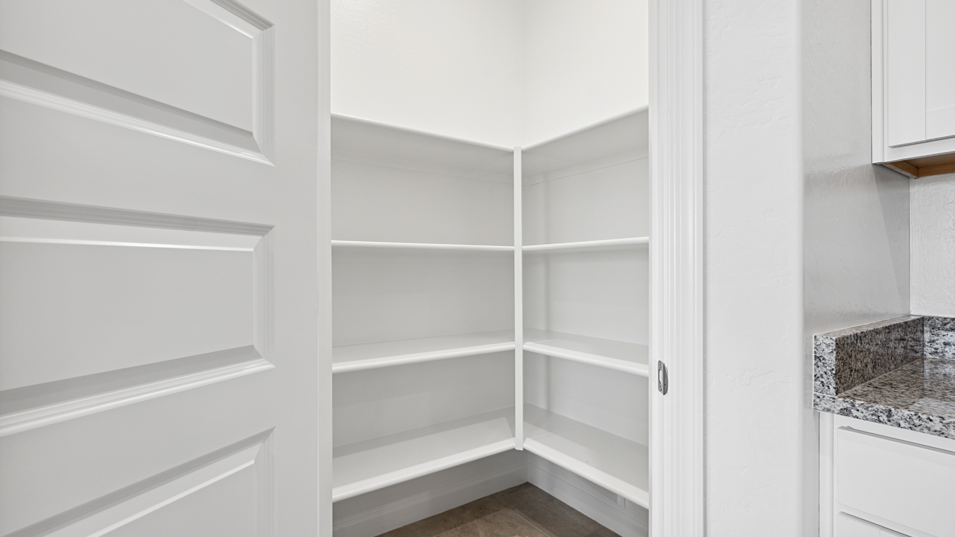 spacious kitchen with large island and walk in pantry