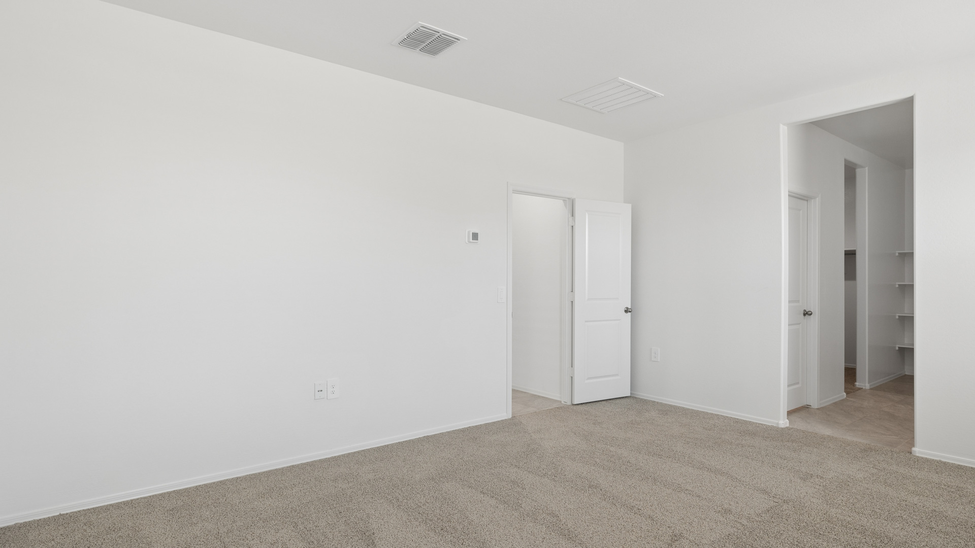Primary suite with walk in closet.